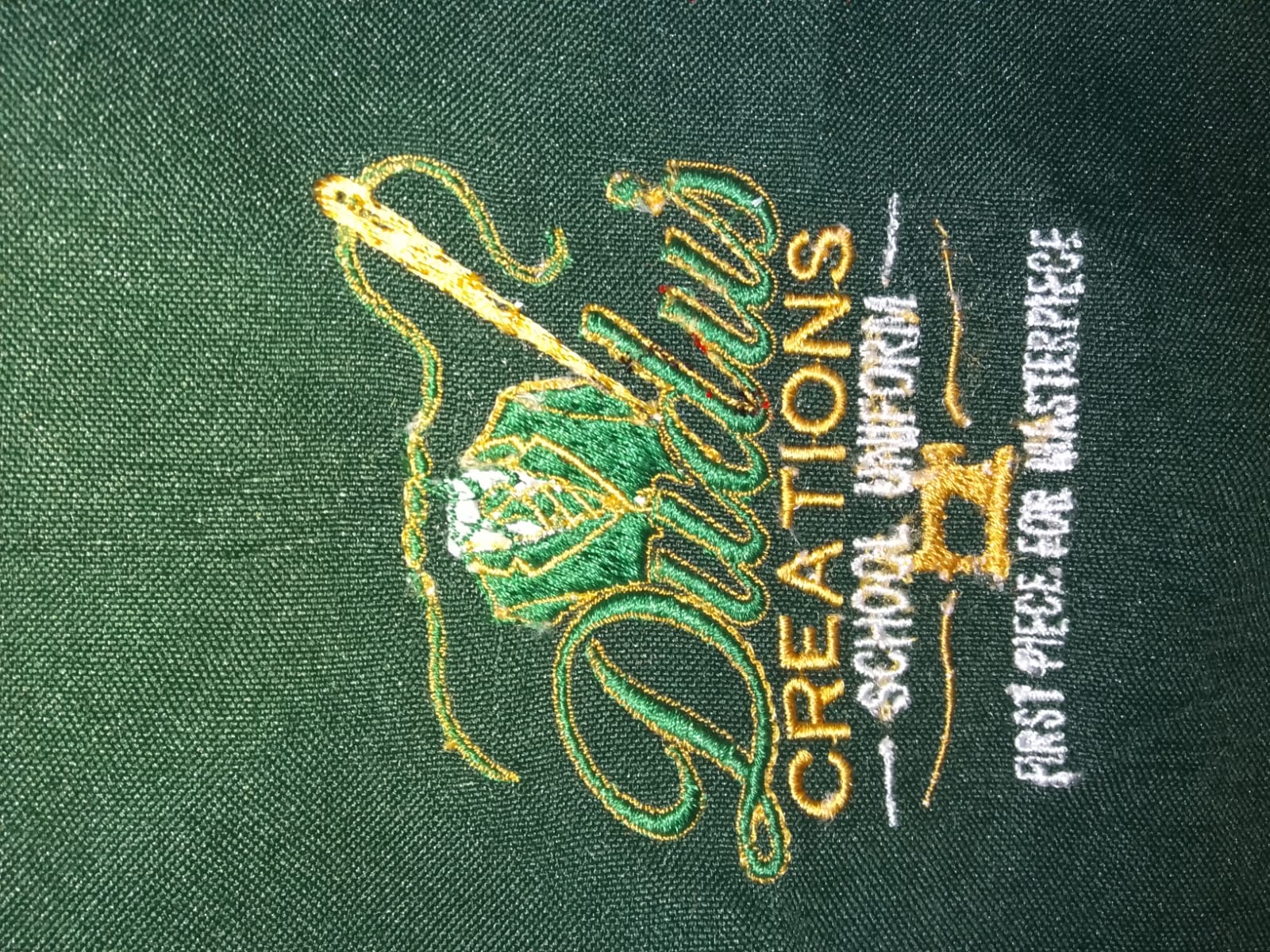 Green embroidered logo for Vukuzenzele Creations
